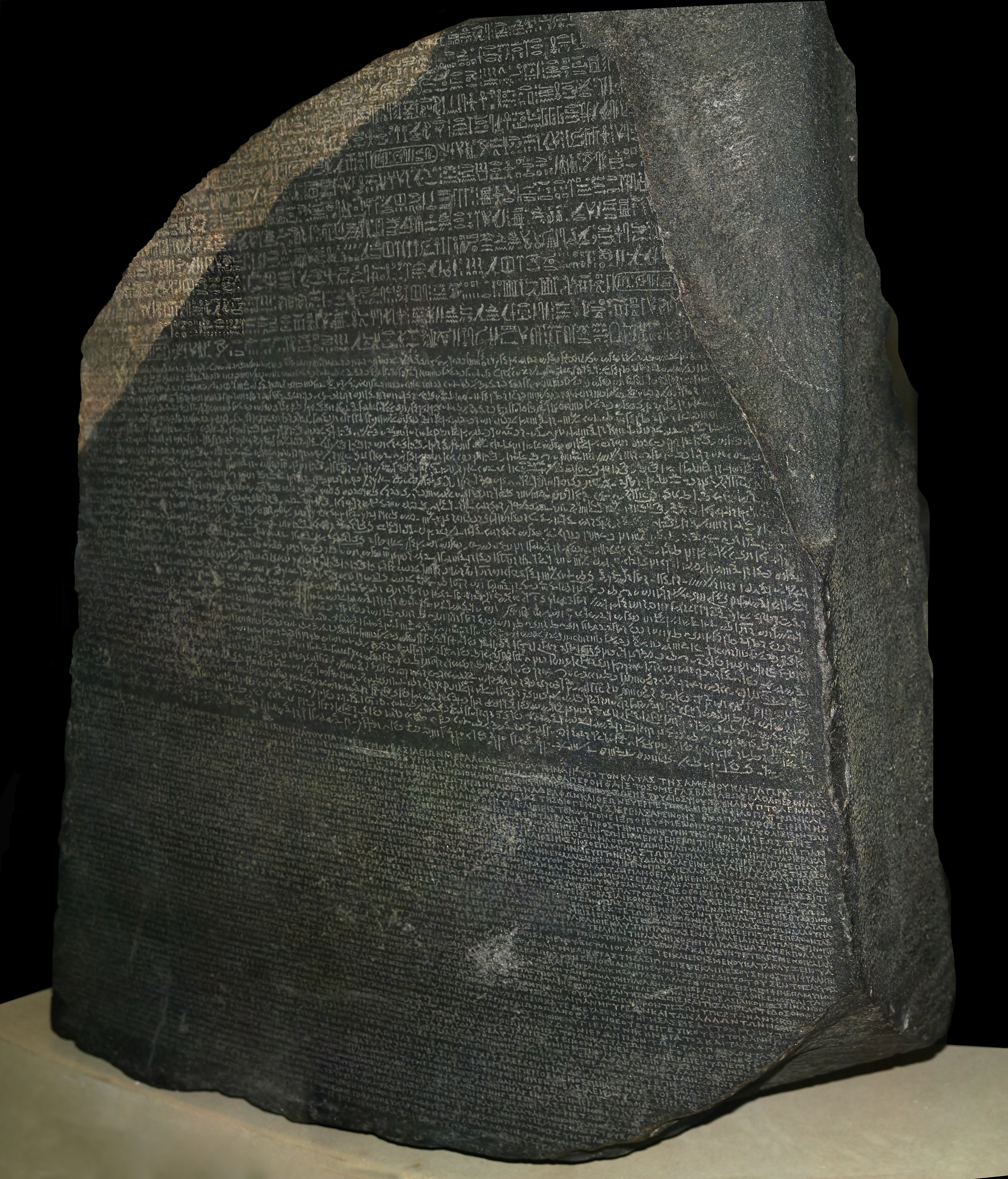 The Rosetta Stone — British Museum. The same decree in hieroglyphs, Demotic, and Greek.
